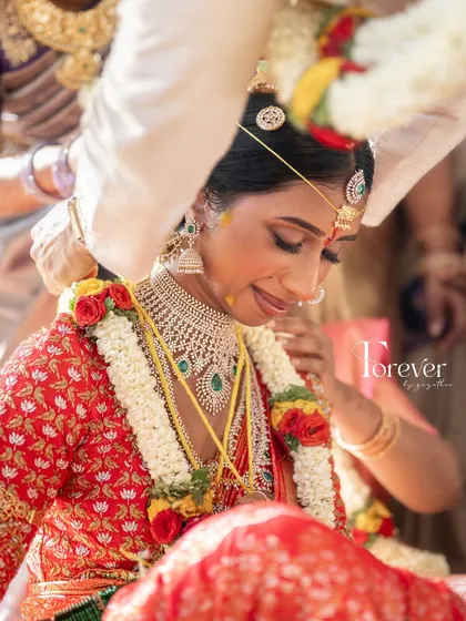 A candid, emotional moment from a Telugu wedding ceremony. The makeup is designed to be long-lasting and tear-proof for these precious moments.