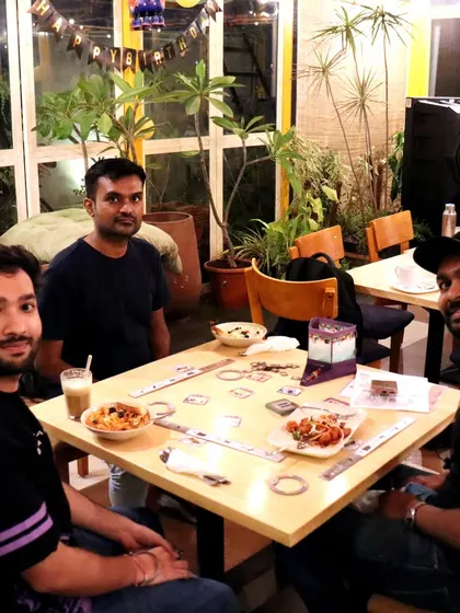 A game of 'Jaipur' over some snacks and cold coffee. It's the perfect way to spend a relaxed afternoon with a friend.