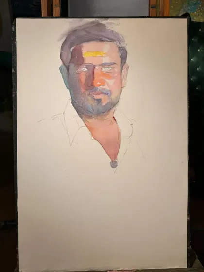 The portrait in its early stages, with the first layers of colour applied to establish the light and shadow.