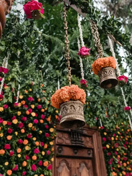 The beauty is in the details. Hanging floral arrangements and traditional temple bells add a layer of texture and elegance to the decor.