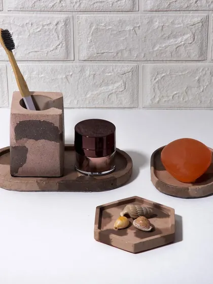 The same concrete bathroom set shown in a different context, highlighting its versatility and organic appeal.