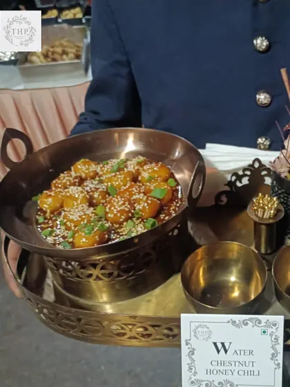 Another one of our popular Indo-Chinese starters, Water Chestnut Honey Chili. Served in a traditional copper kadai by our uniformed staff, it adds a touch of class to your event.