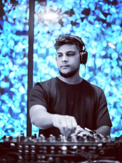 A cool, blue-toned shot of me against a visual backdrop. This highlights the integration of visuals in my performances.