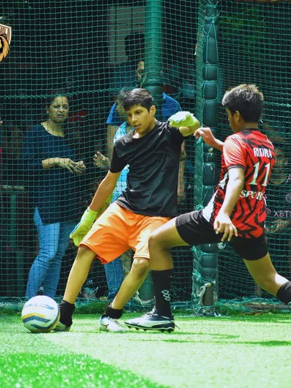Our goalkeeper bravely coming out to challenge for the ball at the feet of an attacker.