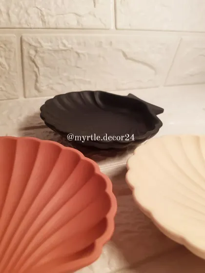 A trio of our mini shell dishes in terracotta, black, and nude. These earthy and classic colors are perfect for a modern, minimalist home.