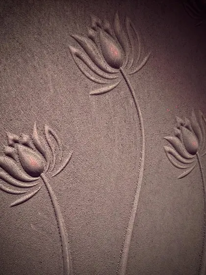 Sometimes raw texture is the most beautiful. This is a close-up of a custom lotus relief we created for an entrance, where the simple, elegant forms bring a sense of organic beauty and calm.