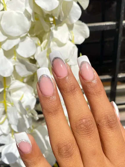 The sunlight catching the glitter on these long French nails is just everything.