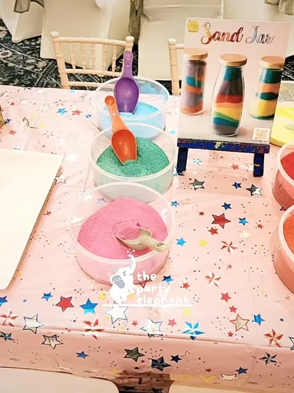 A sand art station set up for the unicorn party. We provide a variety of engaging and themed activities to keep the little guests entertained throughout the celebration.