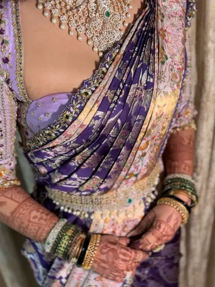 A close-up of my signature drape on a bride, showing how the pleats fall gracefully.