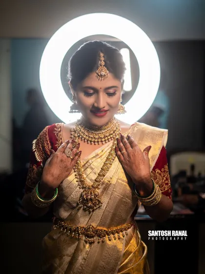 A stunning bridal portrait using a ring light to create a beautiful halo effect and highlight the bride's features. We focus on capturing the elegance and joy of the bride on her special day.