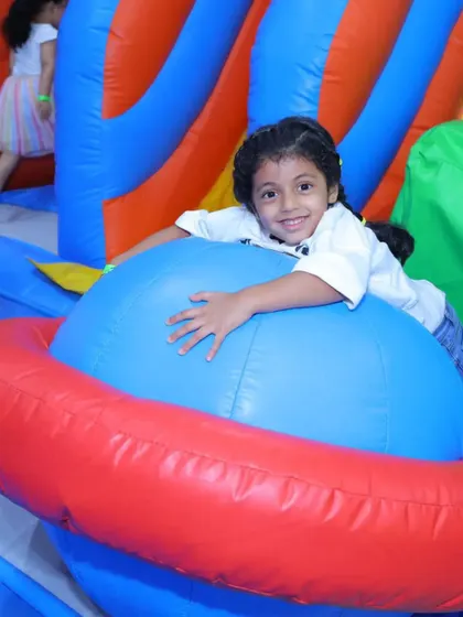 This little girl is having a great time on one of our inflatable rides, perfect for imaginative play.
