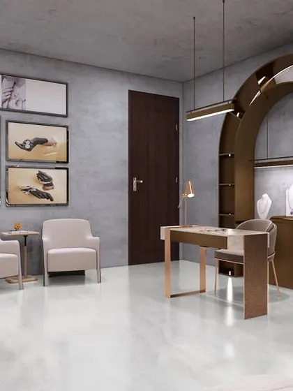Another view of the studio, highlighting the use of framed art and varied seating options. The design creates a gallery-like feel, elevating the entire experience.