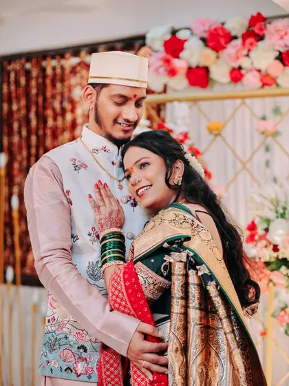 A warm embrace between a newly engaged couple, capturing their happiness.