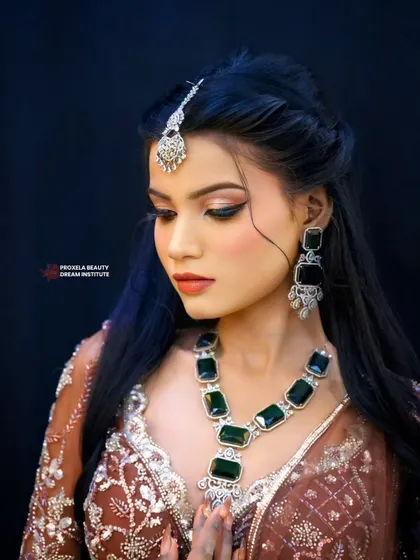 This look is about feeling unstoppable. The makeup features a subtle smokey eye and a neutral lip, creating a powerful yet understated glam vibe.