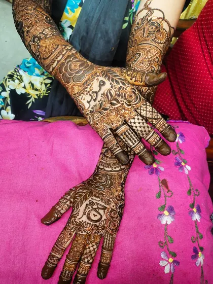 The full view of a custom bridal piece, with different stories and motifs on each hand.