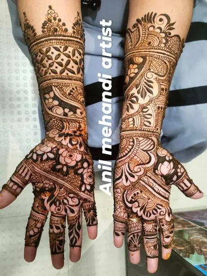 A beautiful example of a full-coverage design with a mix of floral, geometric, and traditional patterns.
