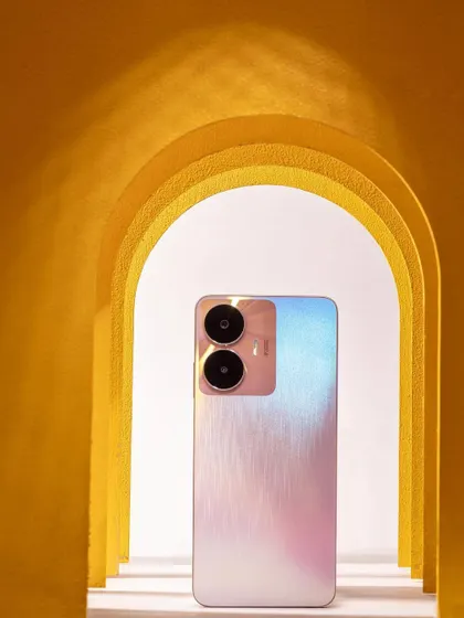 A slightly different angle of the Realme C55 within the paper arches, showing how minor adjustments in composition can create a new feel.