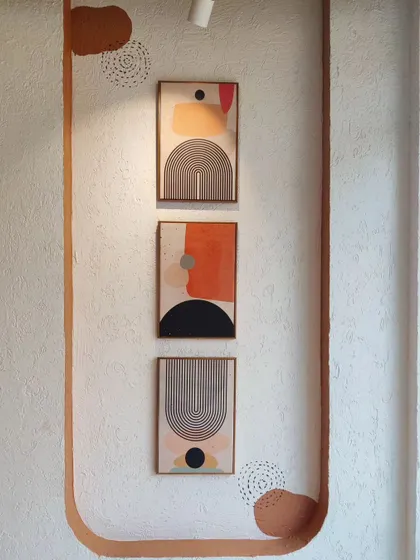 A small gallery wall I created at Cafe Berni, featuring framed abstract prints that complement the larger murals and complete the decor.