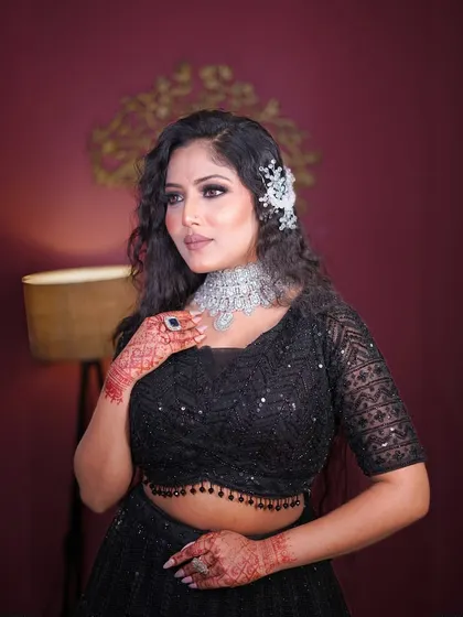 Another portrait in the black sequin lehenga, exuding confidence and style.