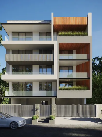 This residential facade shows how greenery can be used as an architectural element. The recessed balconies are lined with wood and filled with plants, creating deep, shaded outdoor rooms that are extensions of the interior space.