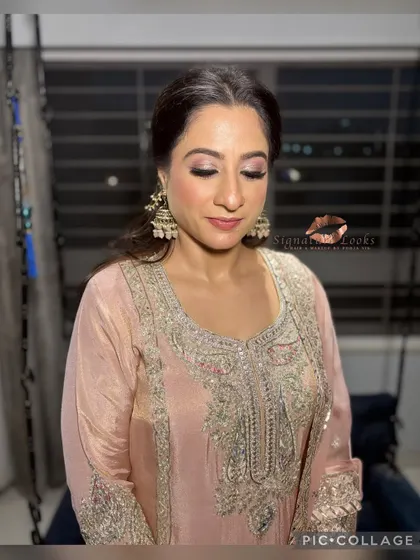 The hairstyle is designed to highlight her features and stay beautiful throughout the event.