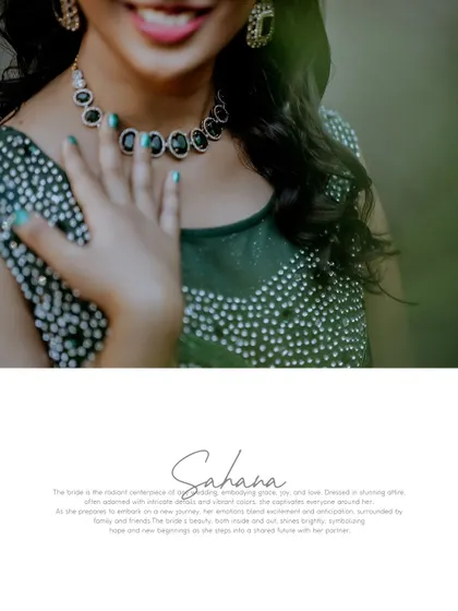 A close-up detail shot of the bride's stunning green gown and necklace, with her name elegantly written below.