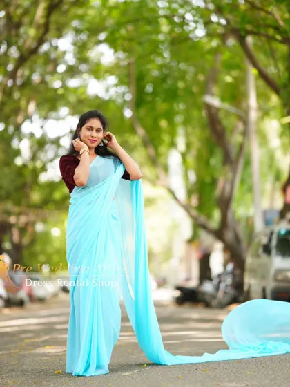 A classic portrait in the sky-blue trail saree.