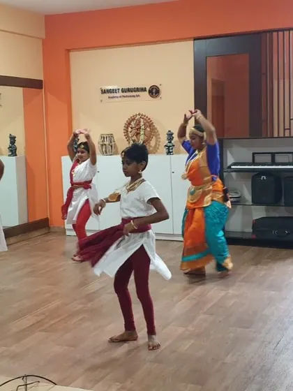 Young dancers practicing their Bharatanatyam adavus (fundamental steps) in our studio. We guide students through each step of their learning journey.