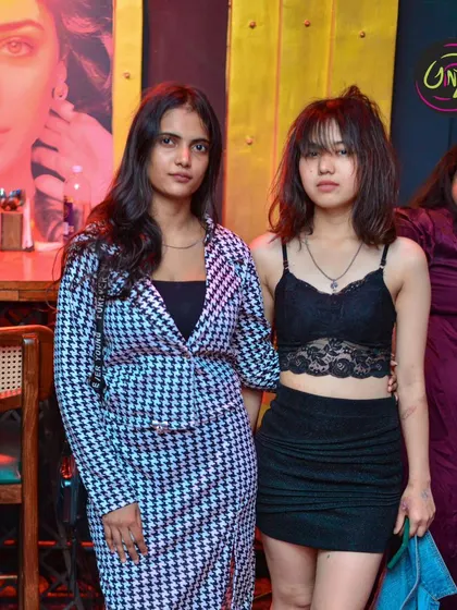 Friends posing in their stylish outfits. My club nights attract a fashionable crowd looking for a great music experience.