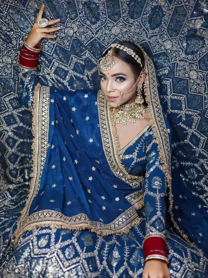 A full-length shot that showcases the grandeur of the entire bridal ensemble.