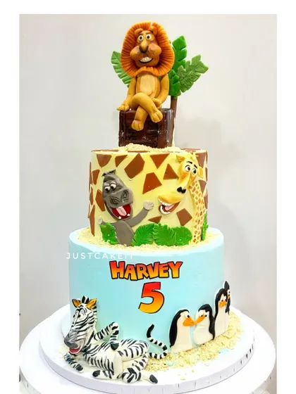 A repeat design of the popular Madagascar cake. This one also survived a trip in heavy rains, arriving perfectly, which is a testament to how I build my cakes.