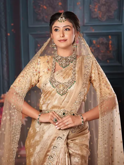 The sheer dupatta adds a layer of mystique to this stunning, modern-traditional bridal look.