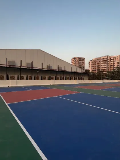 A clear daytime view of the multiple courts at my Vile Parle facility. You can see the clean lines and high-quality surface that ensures a great game every time.