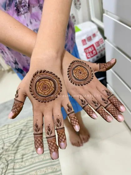 A simple and sweet flower mandala. This design is perfect for someone who wants a touch of henna without a full-hand design. The rose in the center is so lovely.