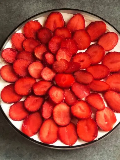 A top-down view of our Strawberry Trifle, showcasing the beautiful floral pattern created with freshly sliced strawberries.