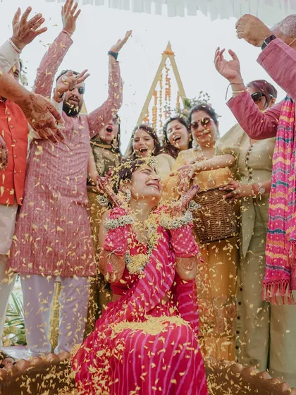 A moment of pure bliss as the bride is showered with flower petals by her loved ones. We aim to freeze these moments of overwhelming joy and celebration.