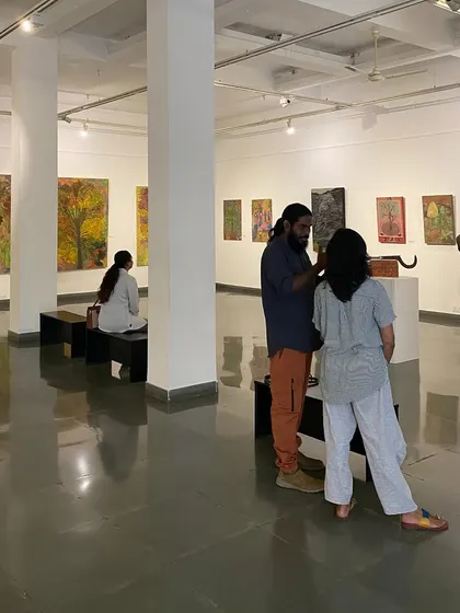 Visitors at the exhibition 'ME, AMMA, WE', a joint show by artist Unnikrishnan C and his mother, Devu Nenmara. The curation placed their distinct yet connected works in direct conversation.