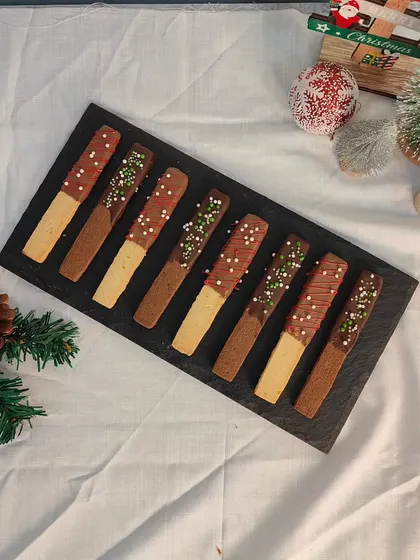 A platter of my Christmas finger cookies, ready to be packed for orders. They are a simple, elegant, and delicious addition to any holiday spread.