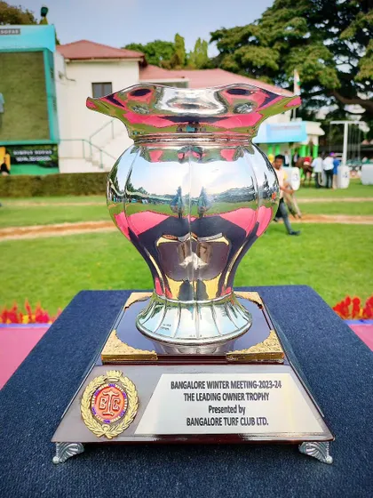 The Leading Owner Trophy, a classic silver vase-shaped cup for the winter season.