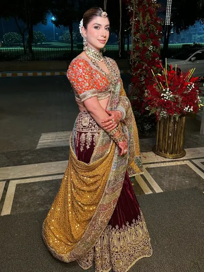 Creating a timeless look with a royal Indian touch. The elegance of this ethnic lehenga-saree is paired with soft, flawless makeup for a perfect harmony of tradition and luxury.