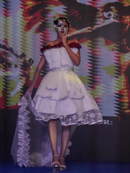 A creative design featuring a tiered skirt and an artistic mask, part of a themed collection at Memorabilia.
