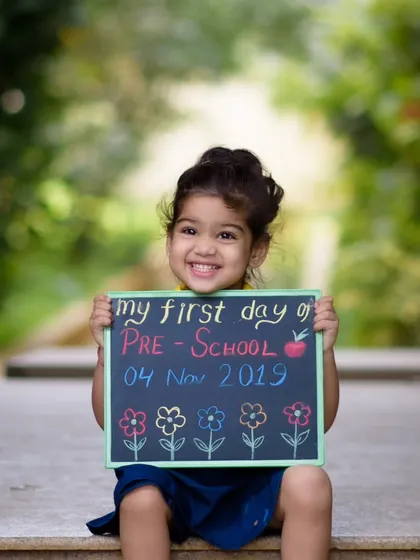 The first day of preschool is a huge milestone, full of excitement and big smiles. We took this photo outdoors to capture the feeling of a new adventure beginning. The little chalkboard sign adds a personal touch, turning a simple portrait into a cherished memory of a very special day.