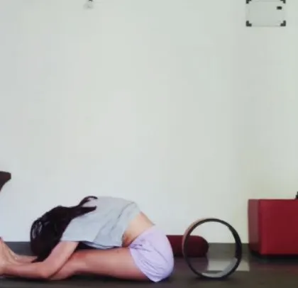 Here you can see the yoga wheel next to me. Even when I don't use it for an intense pose, having props nearby reminds me that there are always ways to support my practice.