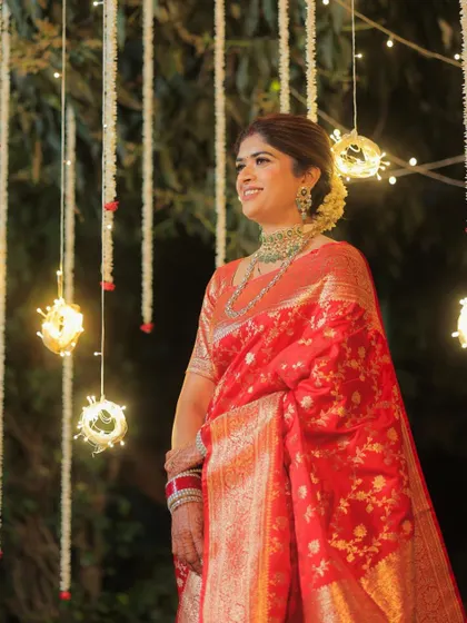 Another beautiful shot of the bride, her makeup looking radiant under the warm lights. This look is a memory in itself.
