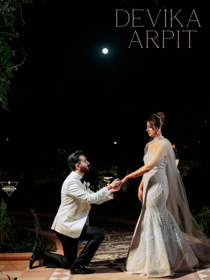A proposal under the moonlight. For this shot, we created a truly cinematic and romantic scene. The dramatic lighting and elegant attire come together to create a powerful, emotional portrait that feels like a still from a classic film, perfect for a glamorous pre-wedding album.