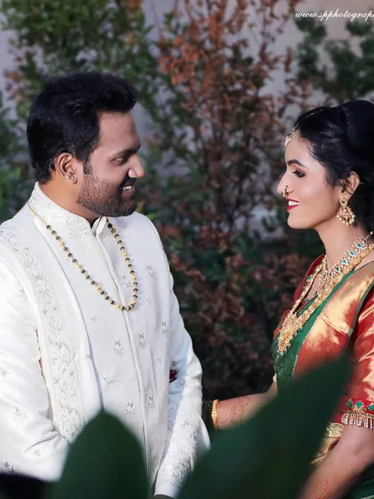 A beautiful portrait of the couple during their engagement or reception. Their coordinated outfits and happy expressions make for a perfect picture.