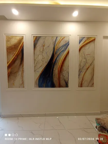 An abstract art wallpaper installed in three separate panels. This triptych arrangement adds a modern, gallery-like feel to the wall.