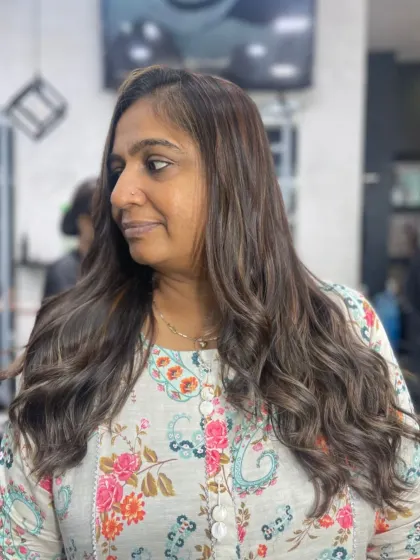 A stunning makeover featuring soft waves, rich color, and fresh layers. This look is a perfect example of hair magic.