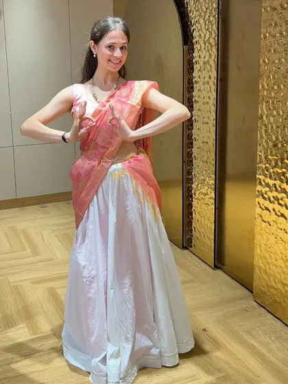 Another pose from the 'Inkem Inkem' showcase, highlighting the graceful hand mudras and posture that are key to this semi-classical dance style.