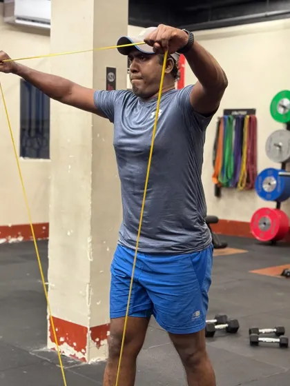 Locked in and focused. These shots capture the intensity and determination of our members during their workouts, from band work and deadlifts to dumbbell presses and rowing.